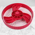 Grey plastic rotating slow feeder bowl for pets with blue silicone lick mat attached