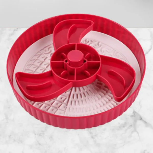 Grey plastic rotating slow feeder bowl for pets with blue silicone lick mat attached
