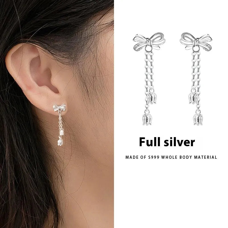 Silver bow ear studs with sweet tassel details and Korean style design for women