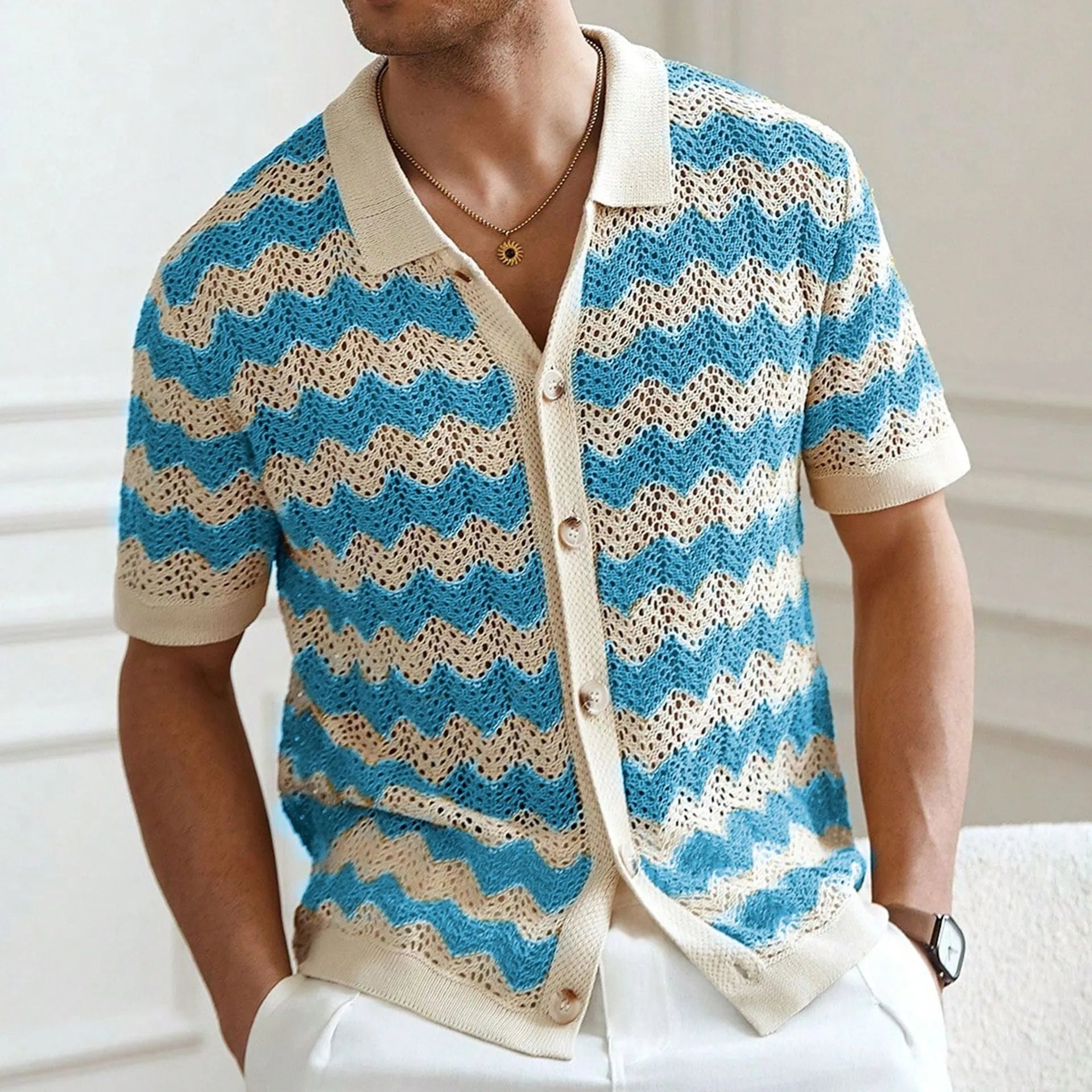 Yellow short-sleeve sweater with a raised corrugated jacquard pattern and a flocked detail on the front.