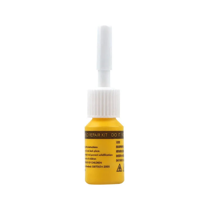 Yellow car windscreen repair kit with UV resin bottle, injection tool, and curing lamp for DIY glass crack repair