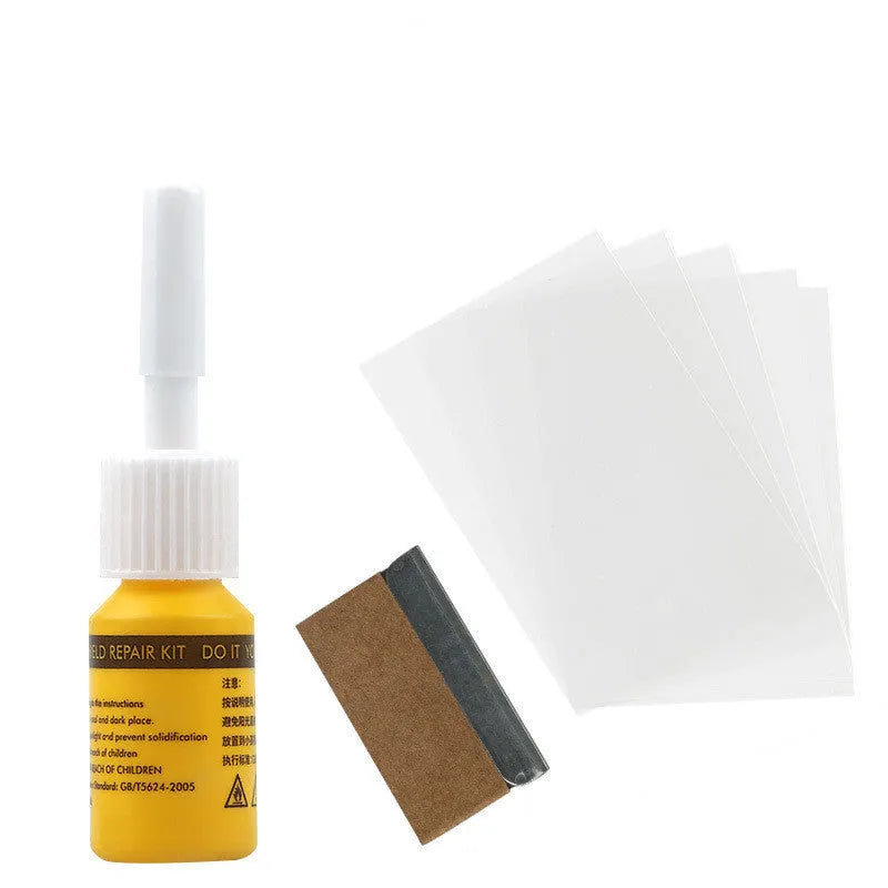 Yellow car windscreen repair kit with UV resin bottle, injection tool, and curing lamp for DIY glass crack repair
