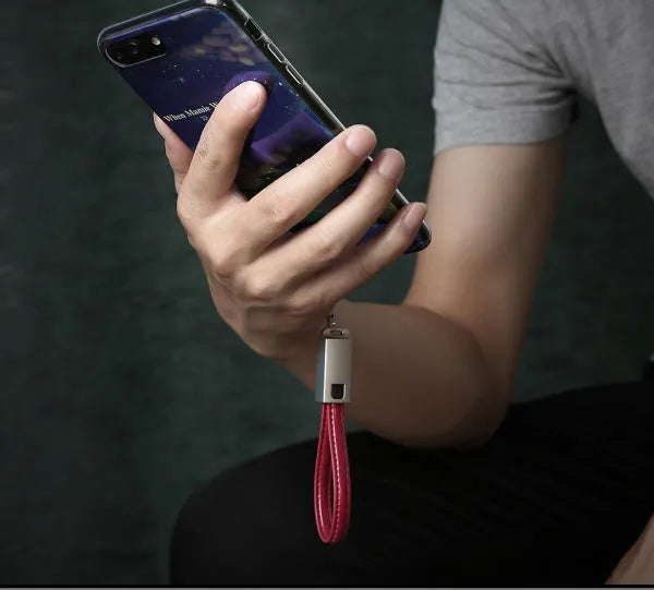 Short 20cm black leather USB to Apple Lightning charging cable with zinc alloy connector.