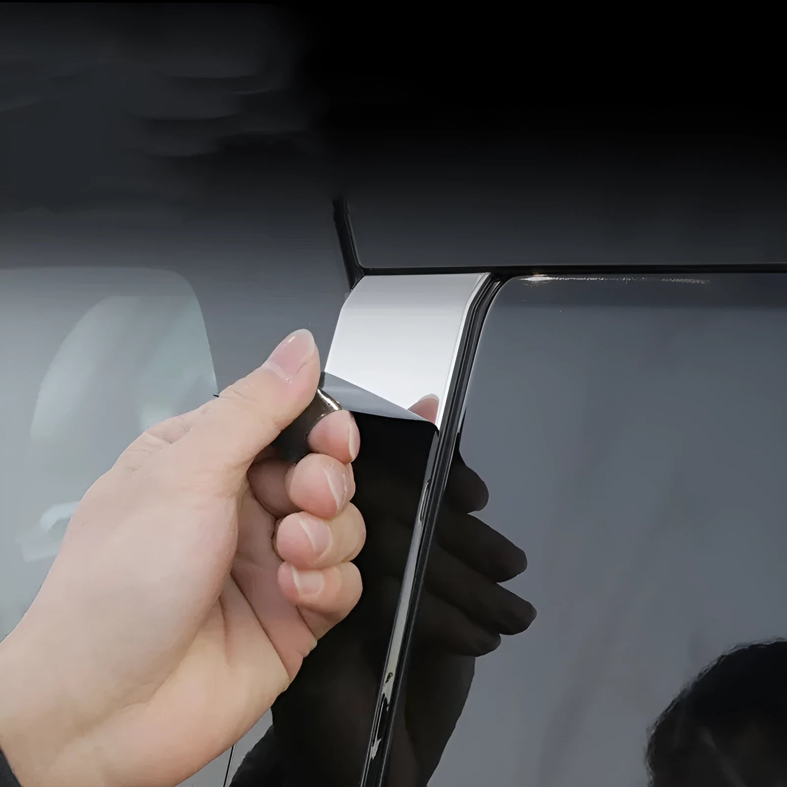 Set of black and carbon fibre pattern adhesive protective films for 23 Mitsubishi Outlander window pillars.