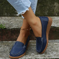 Women's black PU leather slip-on loafers with a round toe and flat rubber sole.
