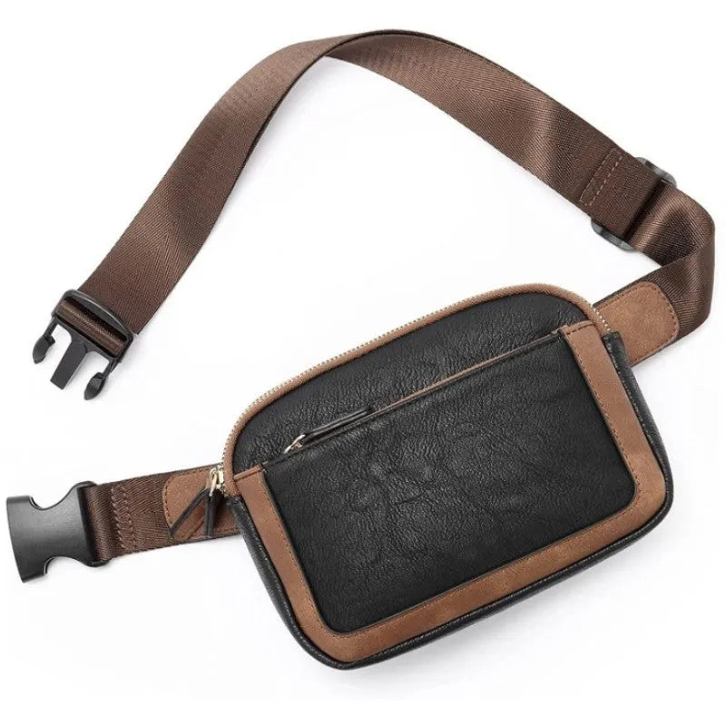 Women's PU leather chest bag in black colour, worn as a crossbody bag with adjustable strap