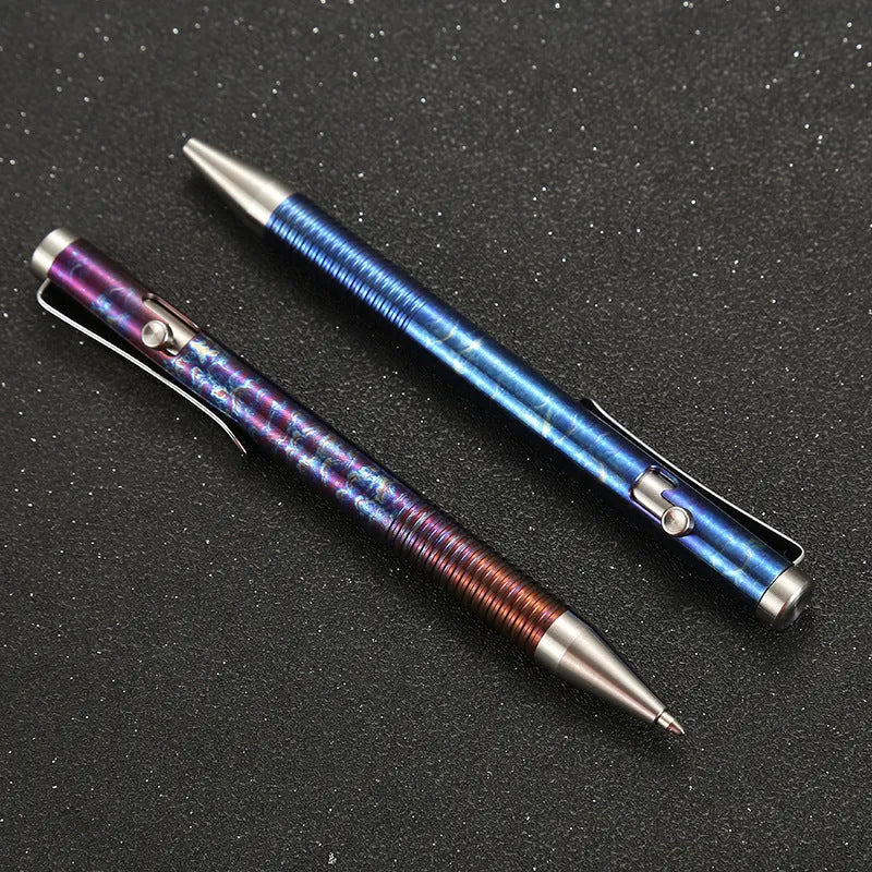 Titanium alloy gun bolt handle ball pen in a multicolour phantom finish, showing bolt action mechanism.