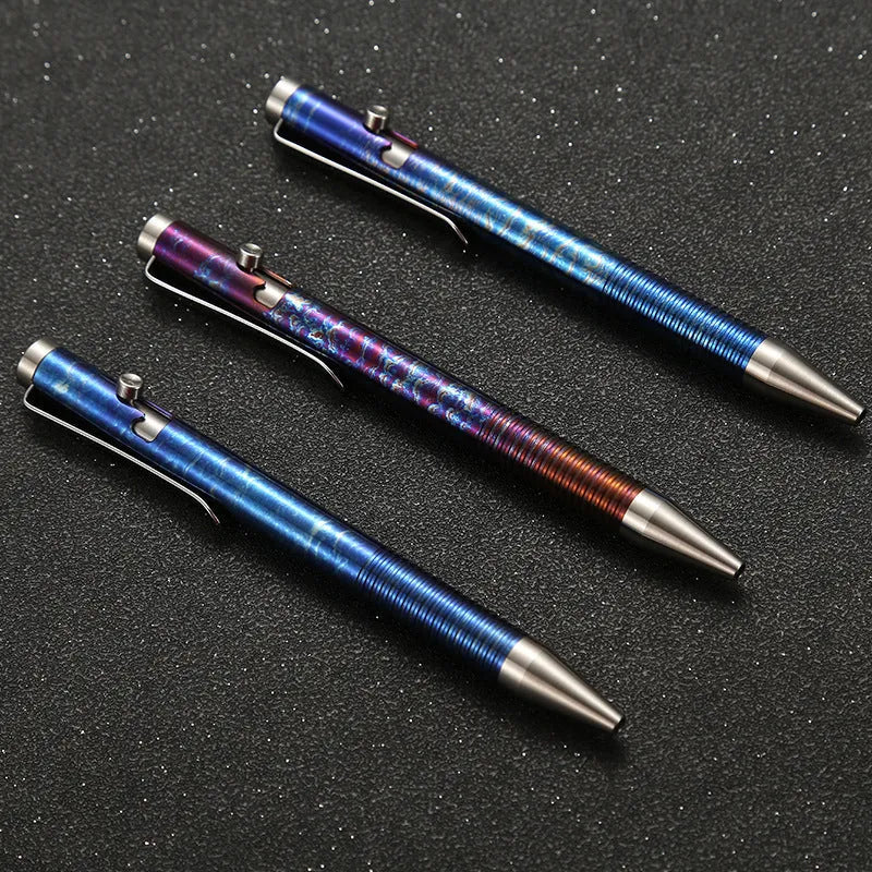 Titanium alloy gun bolt handle ball pen in a multicolour phantom finish, showing bolt action mechanism.