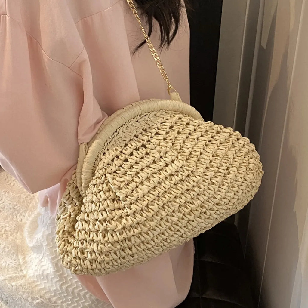 Women's khaki shell-shaped straw shoulder bag with a chain strap detail