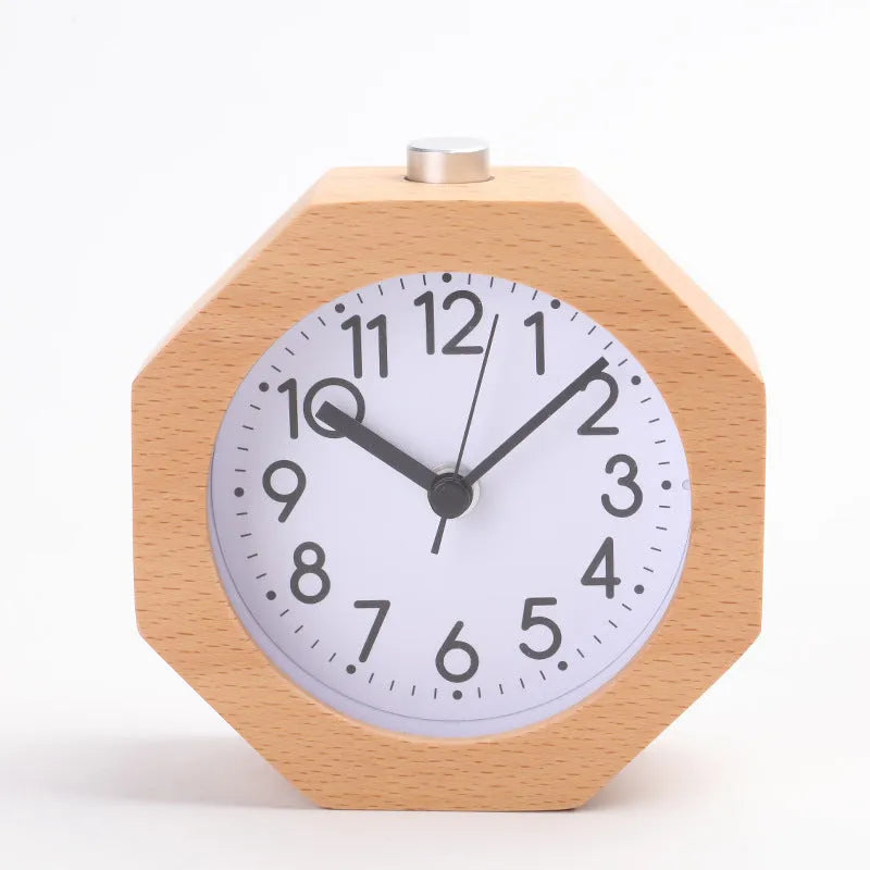 Wooden hexagonal alarm clock with luminous dial and beech finish on a nightstand