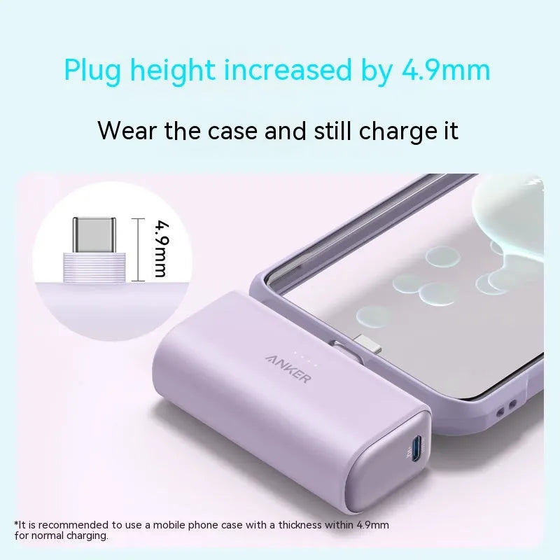 Small capsule-shaped power bank in multiple colours showing built-in foldable USB-C cable and compact size.
