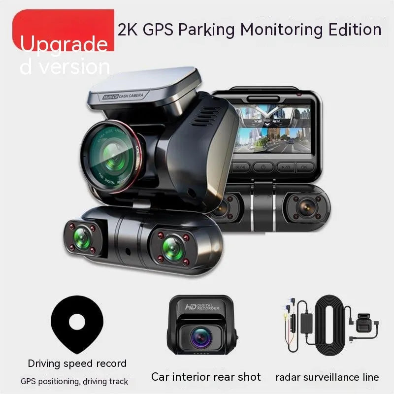 Black four-lens car dash cam with 2-inch screen mounted on a car windscreen.