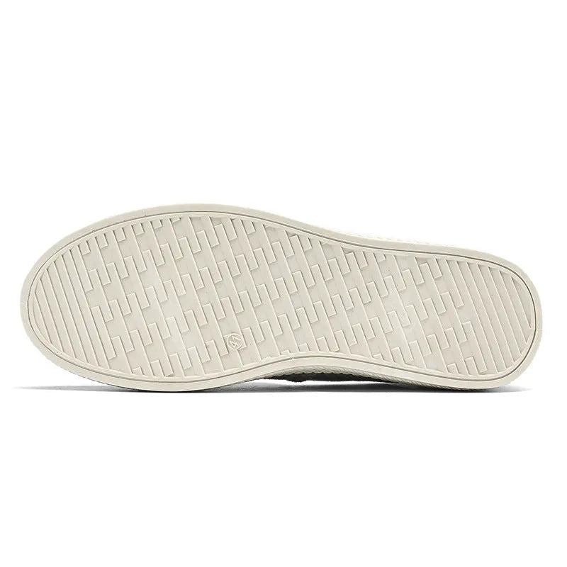 Men's beige linen canvas slip-on shoes with round toe and shallow cut design on a grey background.