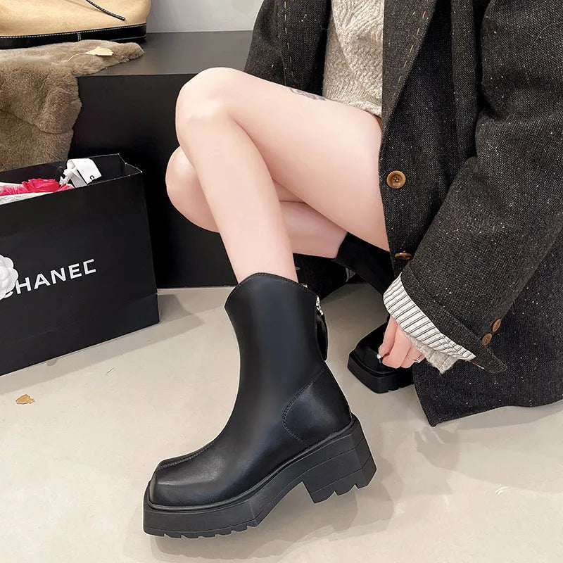 Black platform Martin boots for women with a square toe and back zipper.