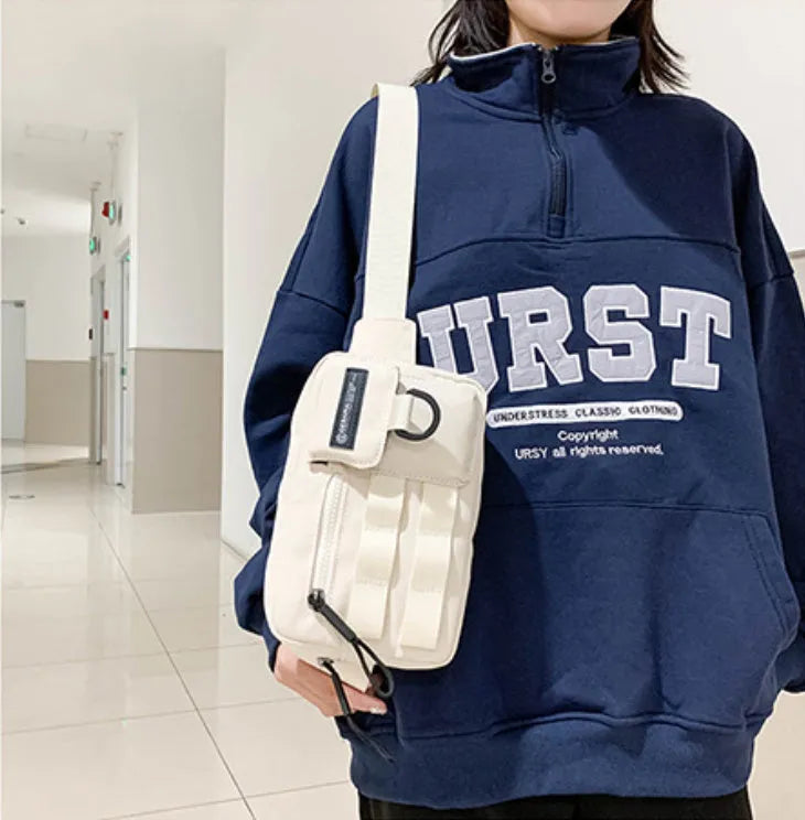 Tooling style crossbody bag in solid colour with wear-resistant nylon for outdoor sports use, below 20L capacity