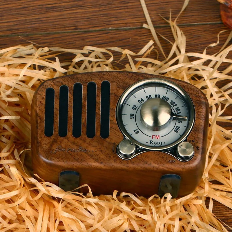Retro wooden mini Bluetooth speaker in cherry or walnut finish showing compact size