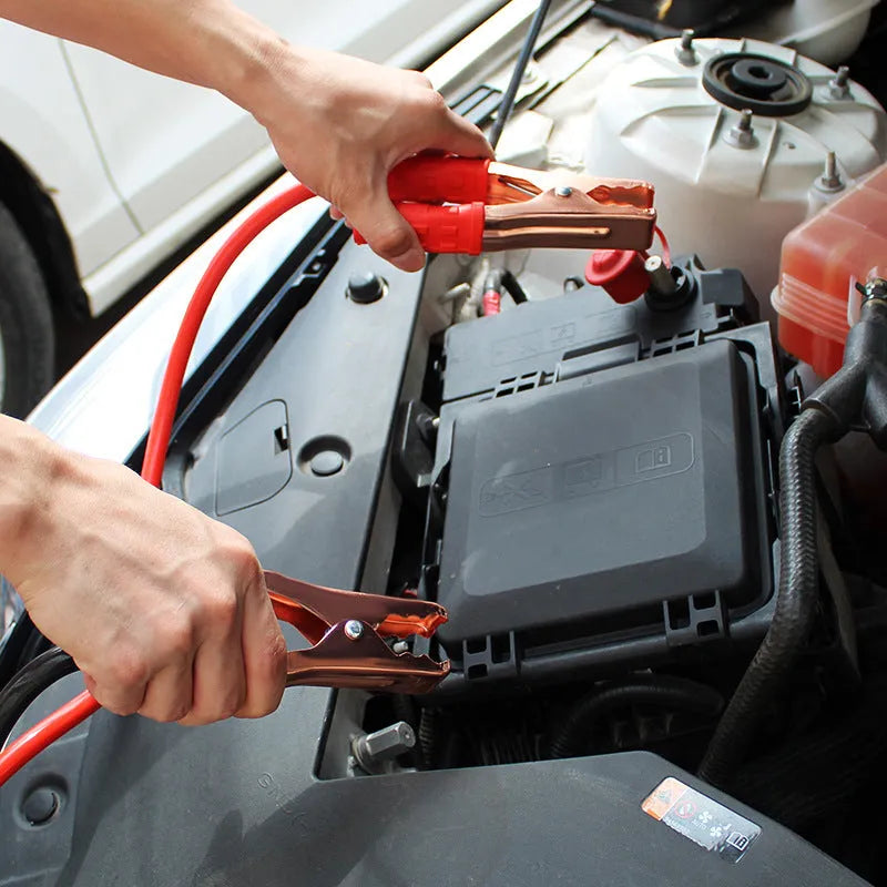 Car battery emergency jump-start cable kit with black and red clips on 2 metre cables