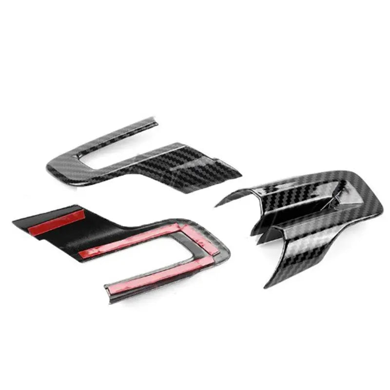 Three-piece ABS plastic car steering wheel decoration set with carbon fibre pattern.