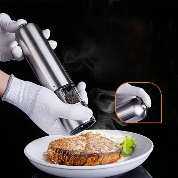Electric stainless steel pepper mill in natural colour, 22.5 cm tall.