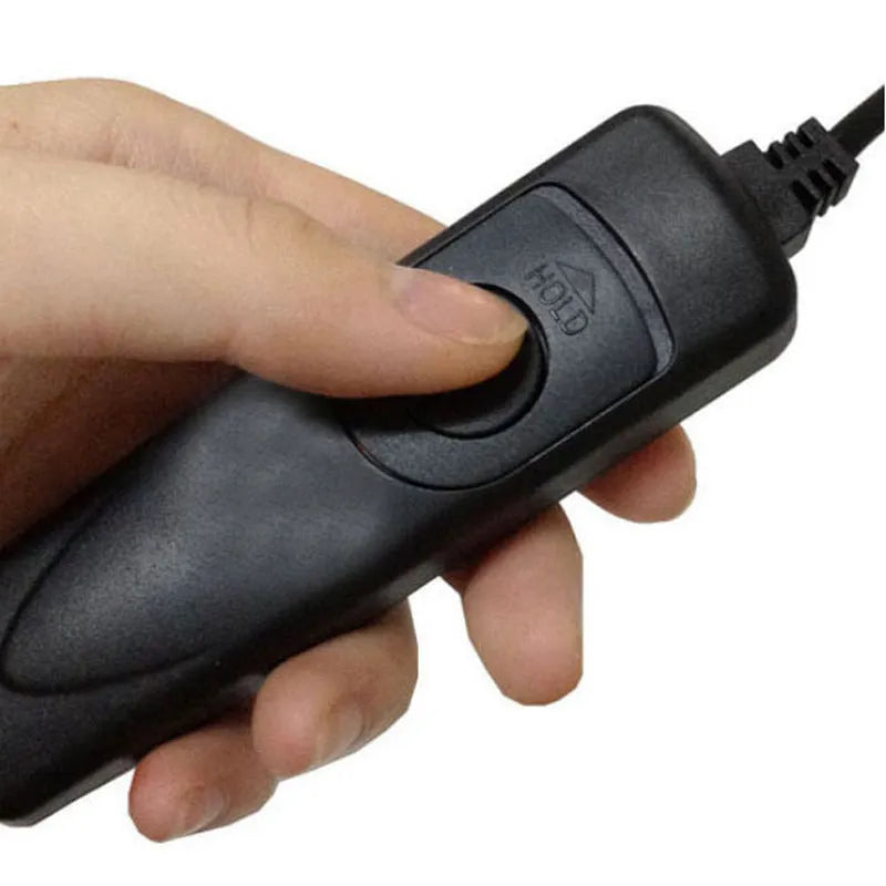 Black plastic wired cable release shutter remote for Canon EOS cameras on white background