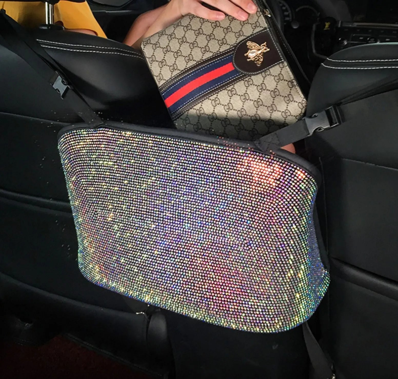 Crystal rhinestone car storage bag organizer with multi-pockets attached to backseat of car, showing white and colour options