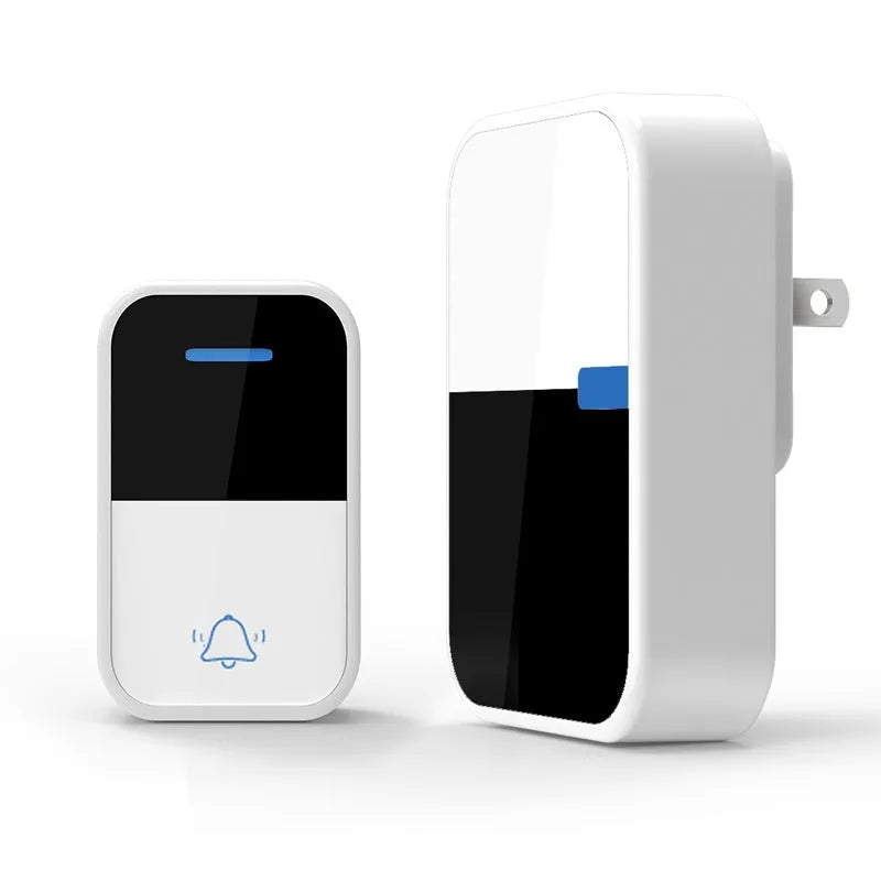 White wireless doorbell receiver and transmitter with modern design on a wooden table.