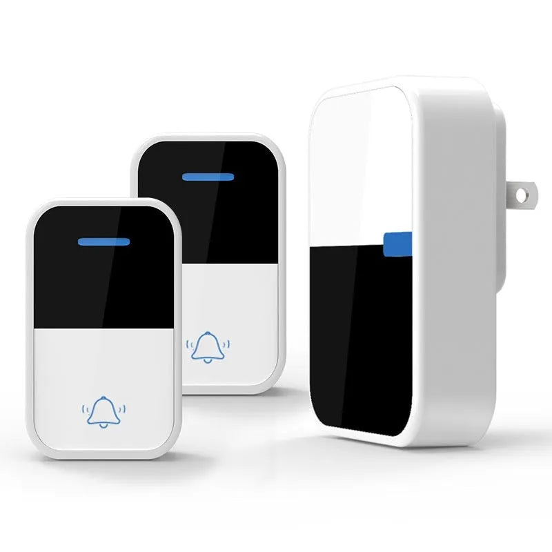 White wireless doorbell receiver and transmitter with modern design on a wooden table.