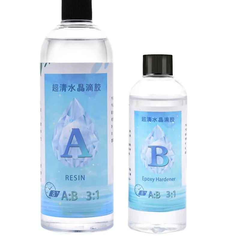 1kg bottle of clear epoxy resin glue and a smaller bottle of crystal drops for DIY crafts.