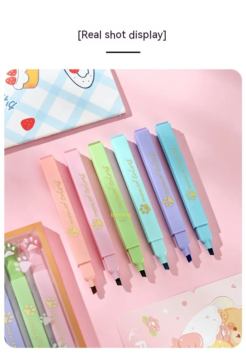 Cat's Paw fluorescent marking pen set showing six coloured pens with oblique heads in a box.