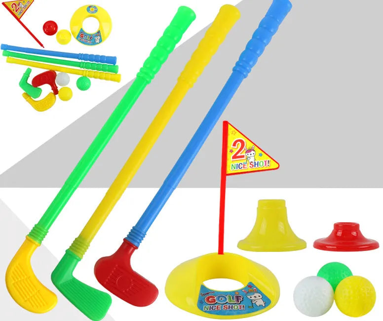 Children's golf set with three multicolour clubs, three balls, a hole, a flag, and two tees on a green background