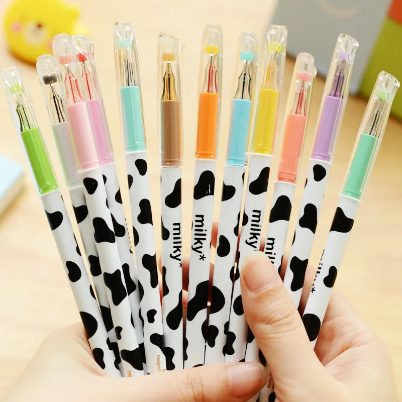 Set of 12 cow pattern gel pens with 0.38mm fine tips in assorted colours.