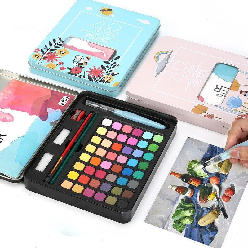 Box containing 48 solid watercolour paint cakes in various colours including black, pink, and blue.