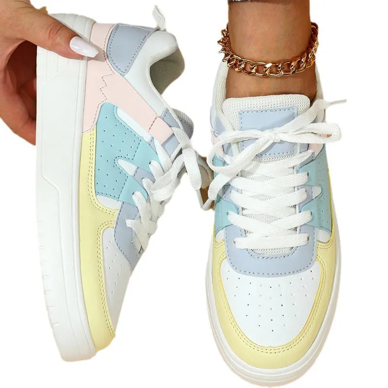 Trendy platform sneakers in white and yellow with breathable mesh upper, lace-up closure, and mid heel sole