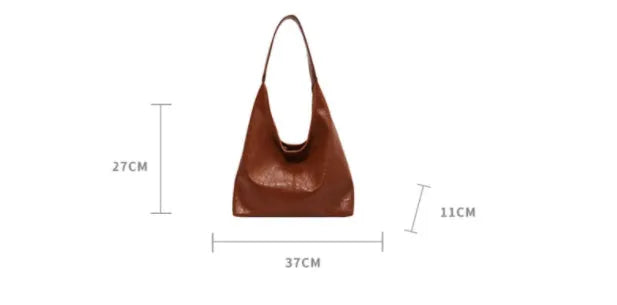 Soft leather shoulder bag with sandwich pocket exterior in multiple colour options