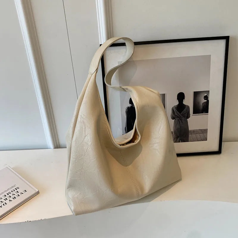Soft leather shoulder bag with sandwich pocket exterior in multiple colour options