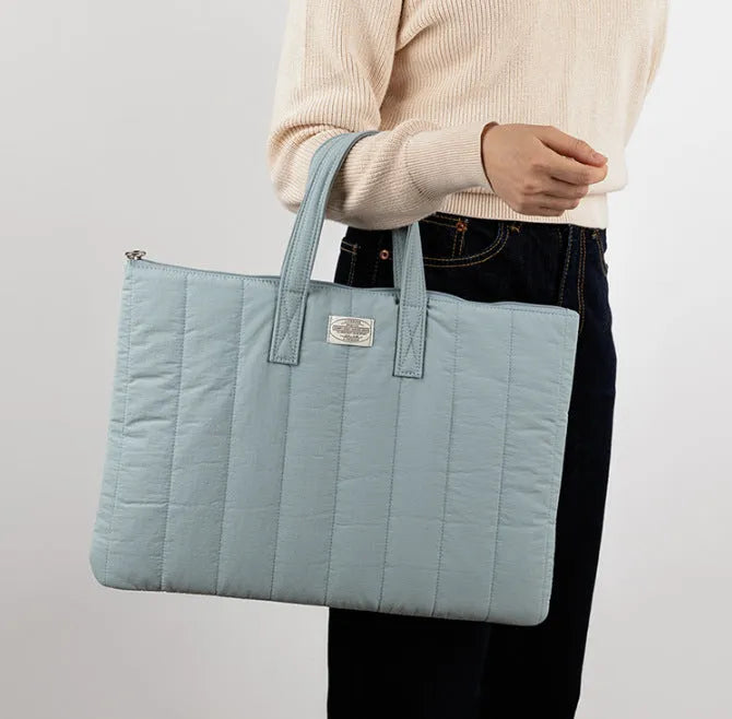Personalised polyester laptop briefcase in black, shown next to matcha and sky blue colour options.