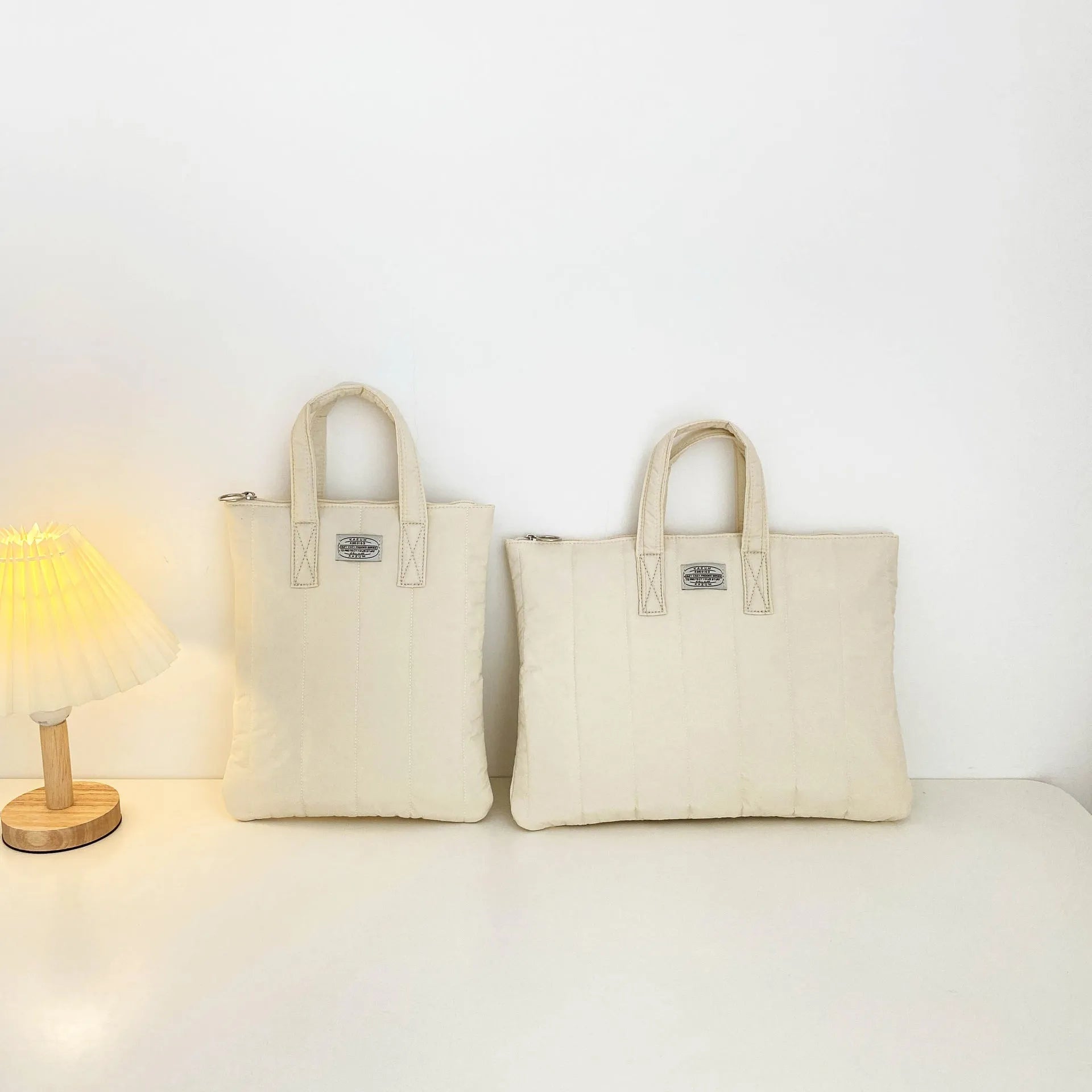 Personalised polyester laptop briefcase in black, shown next to matcha and sky blue colour options.