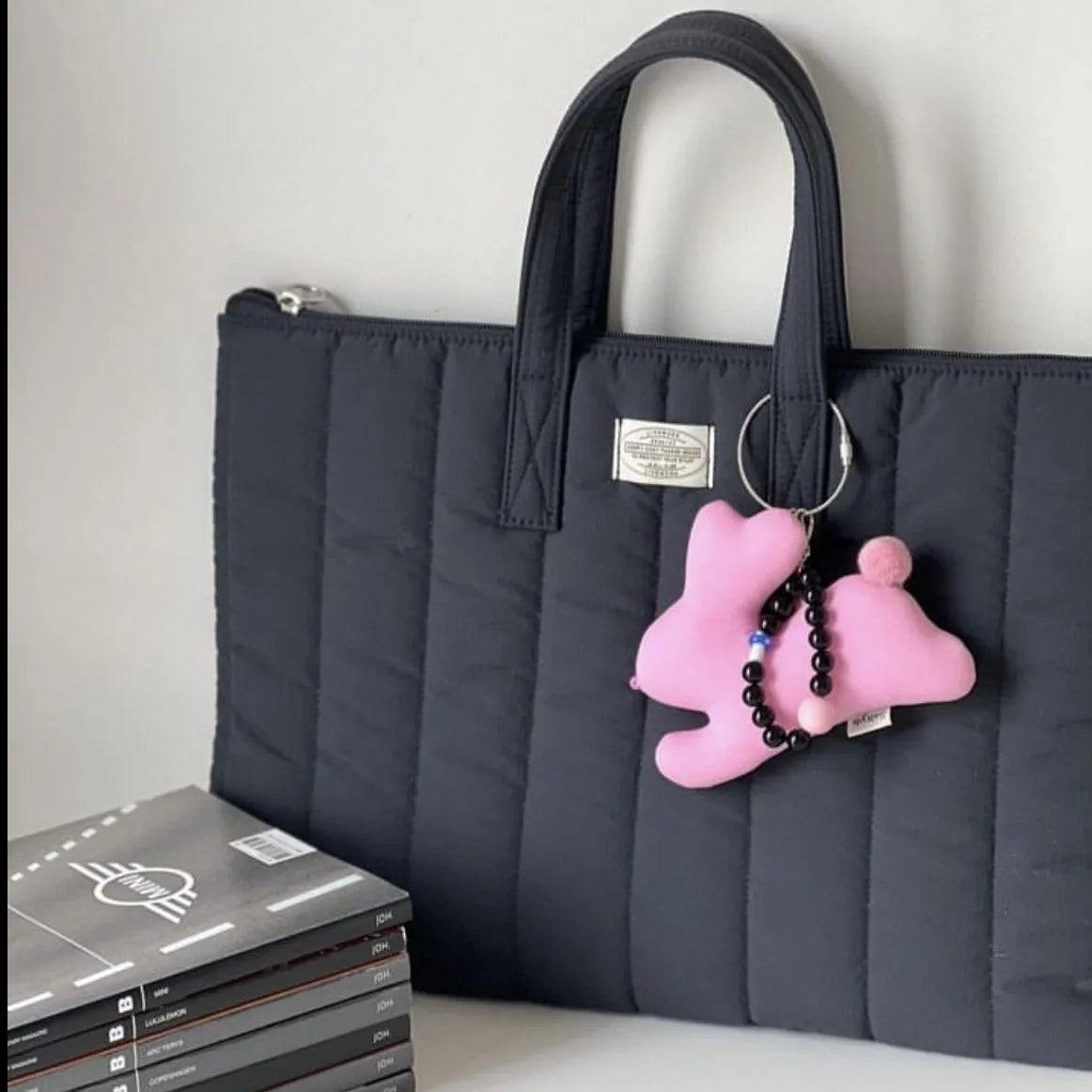 Personalised polyester laptop briefcase in black, shown next to matcha and sky blue colour options.