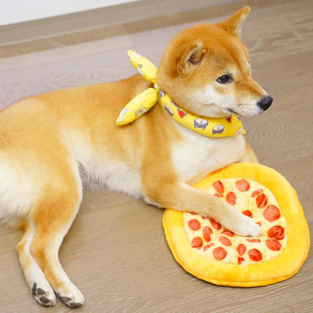 Yellow pizza slice plush dog chew toy with textured grinding surface