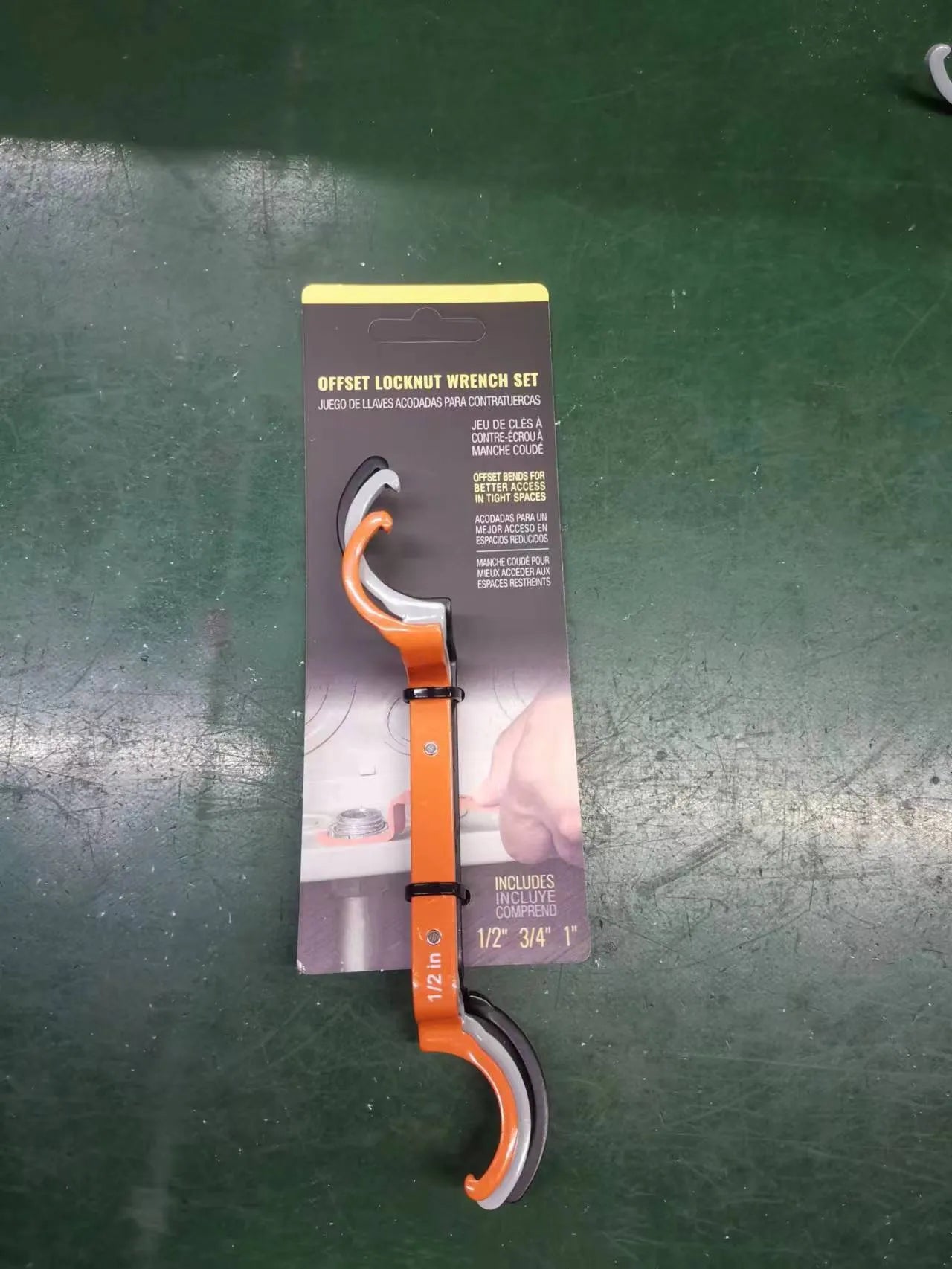 Three magnetic crescent wrenches in orange, grey, and black with locking mechanism and suction feature