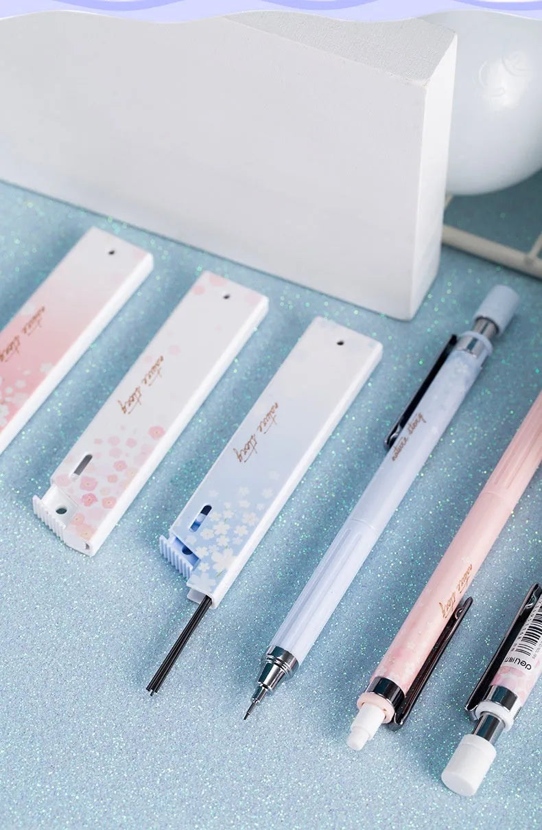 Cartoon style 0.5mm automatic pencil set with three pencils and three HB lead refill boxes.
