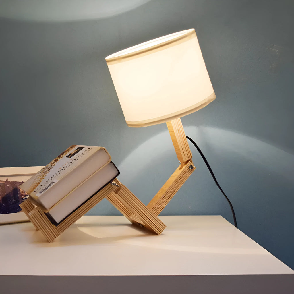 Creative wooden humanoid table lamp with white fabric shade on desk, 22x44x16 cm, button switch