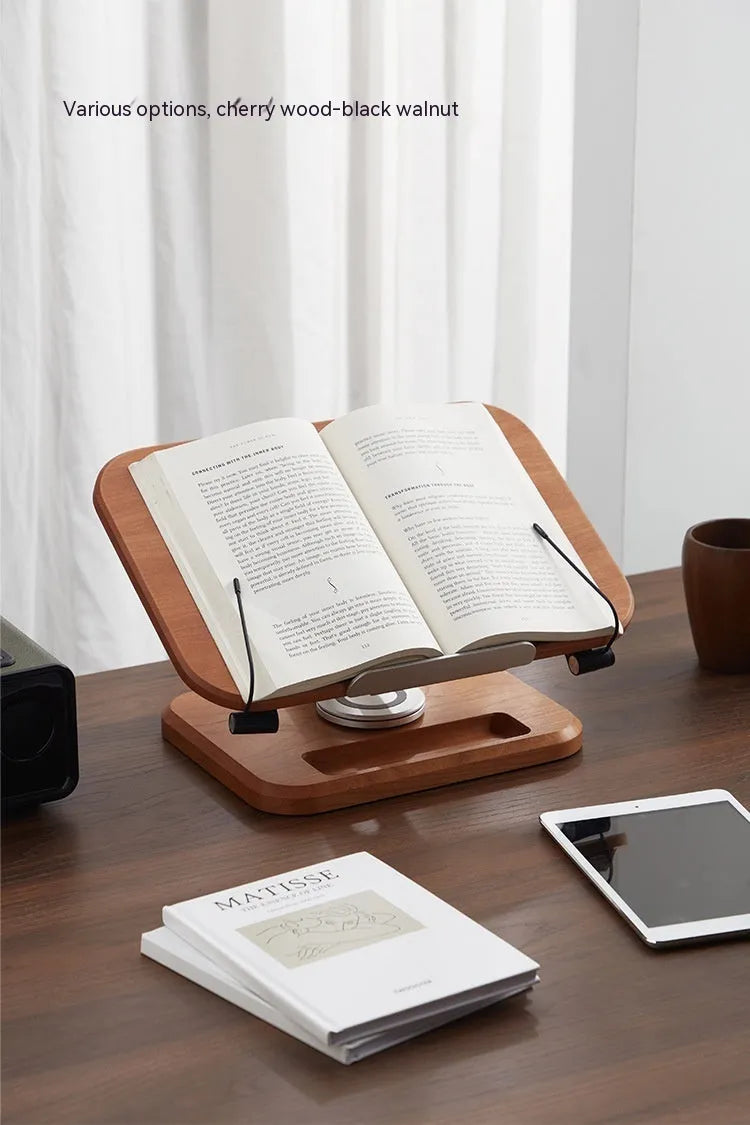 Adjustable walnut-coloured solid wood reading rack holding a book at an angle.
