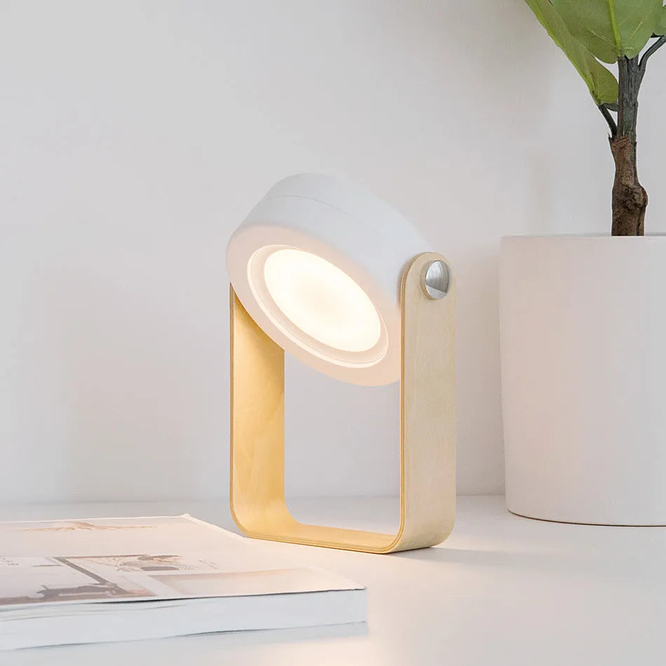 Foldable touch dimmable LED night light in white showing table lamp and lantern positions