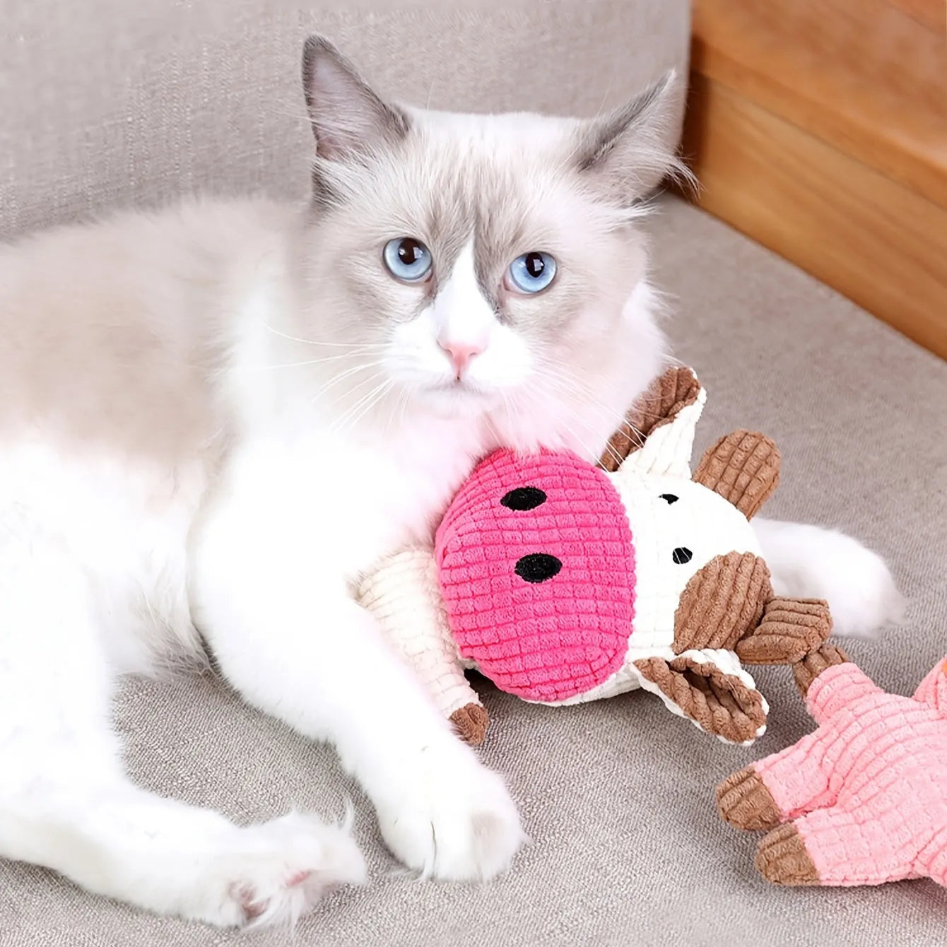 Animal-shaped plush dog chew toy with squeaker in multiple colour options