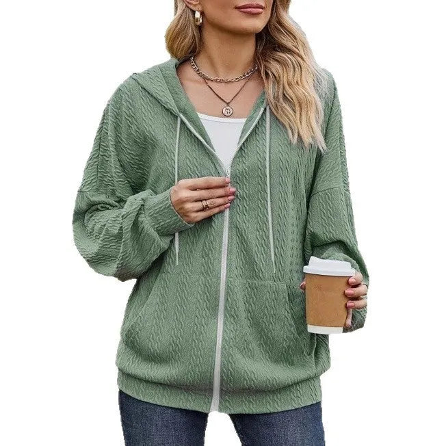 Green women's loose fit hooded sweater with full-length front zipper, long sleeves, and a casual style.