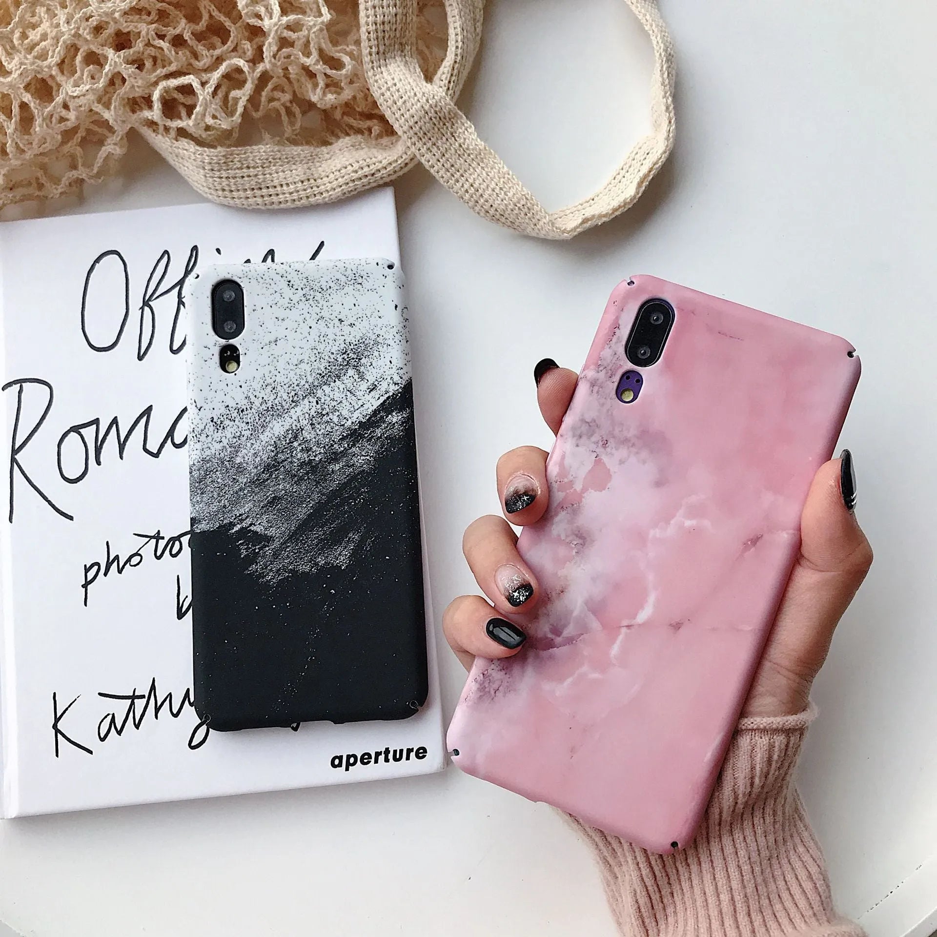 Painted pure colour black and pink phone back cover cases for Huawei models on a white background.