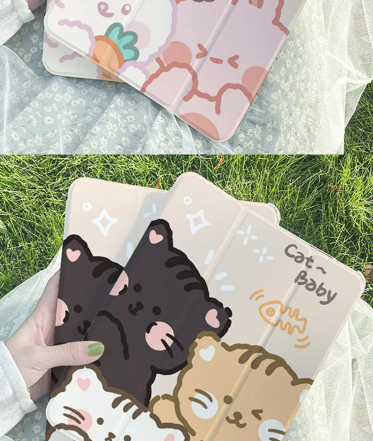 Flat tri-fold silicone iPad case with rabbit cartoon design on a table.