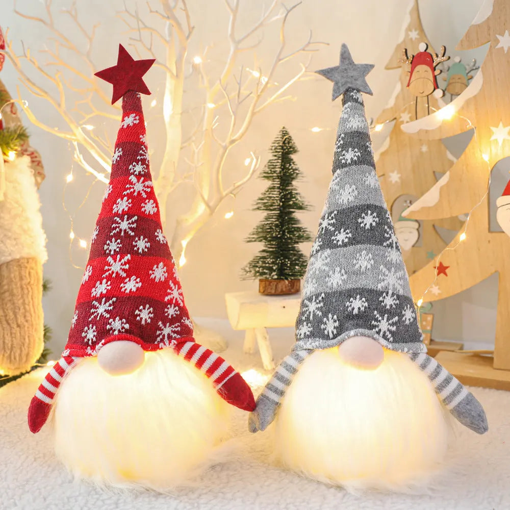 Christmas gnome faceless doll with LED light in red and green, 41 cm tall, on a shelf