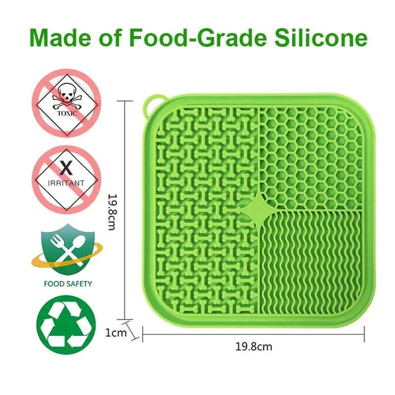 Square orange and grey silicone dog licking mat with textured surface and suction cups on the back.